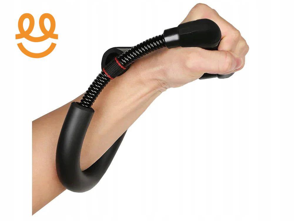 Hand gripping black wrist and forearm exerciser with spring resistance against white background