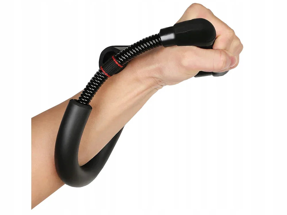 Hand gripping black wrist and forearm exerciser with spring resistance against white background