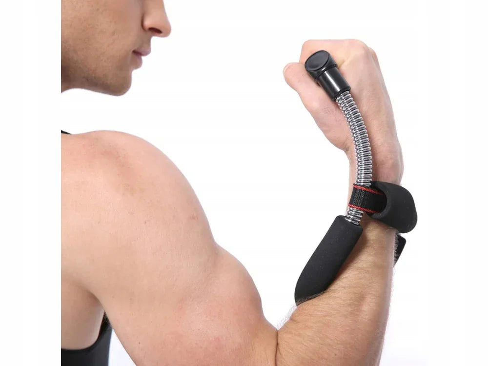 Close-up of a man’s arm using a wrist forearm exerciser with black grips and a metal spring