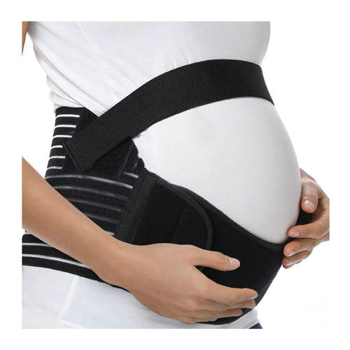 Pregnant woman wearing a black maternity support belt over a white shirt