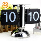 Retro flip clock showing 10:10 AM with chrome stand and decorative yellow flowers background