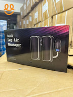 Box of Calf & Leg Air Massager with control device shown, placed on cardboard in warehouse