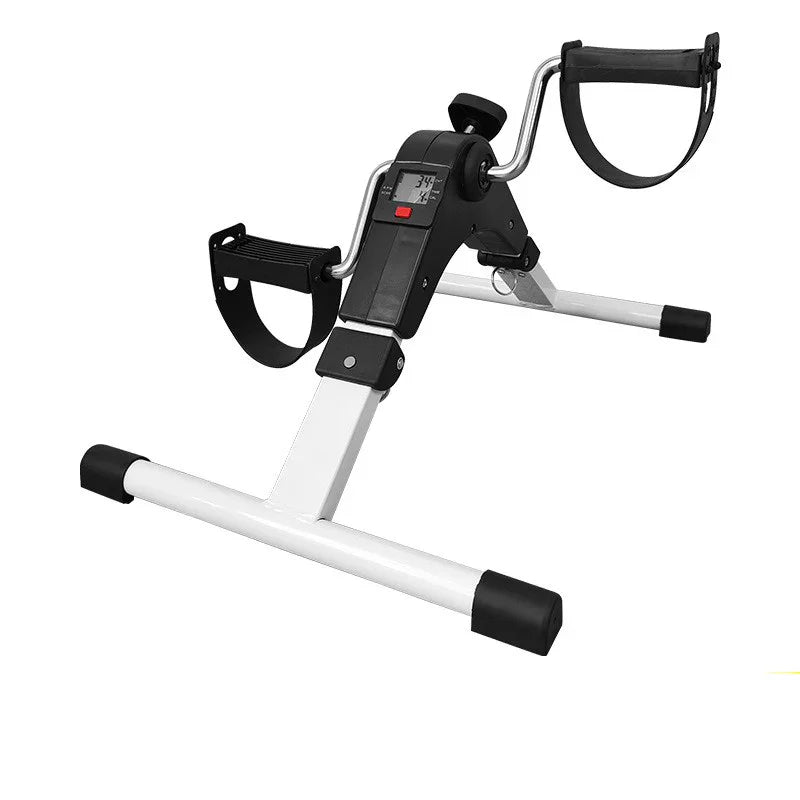 Compact white and black mini exercise bike with pedals and digital display for home workout