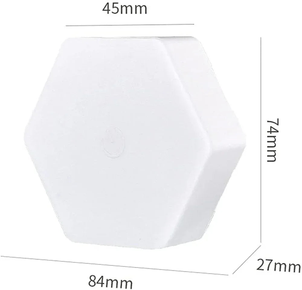White hexagonal object with dimensions 84mm by 74mm by 27mm and 45mm on top