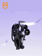 Black foldable stroller against purple background with white feathers floating