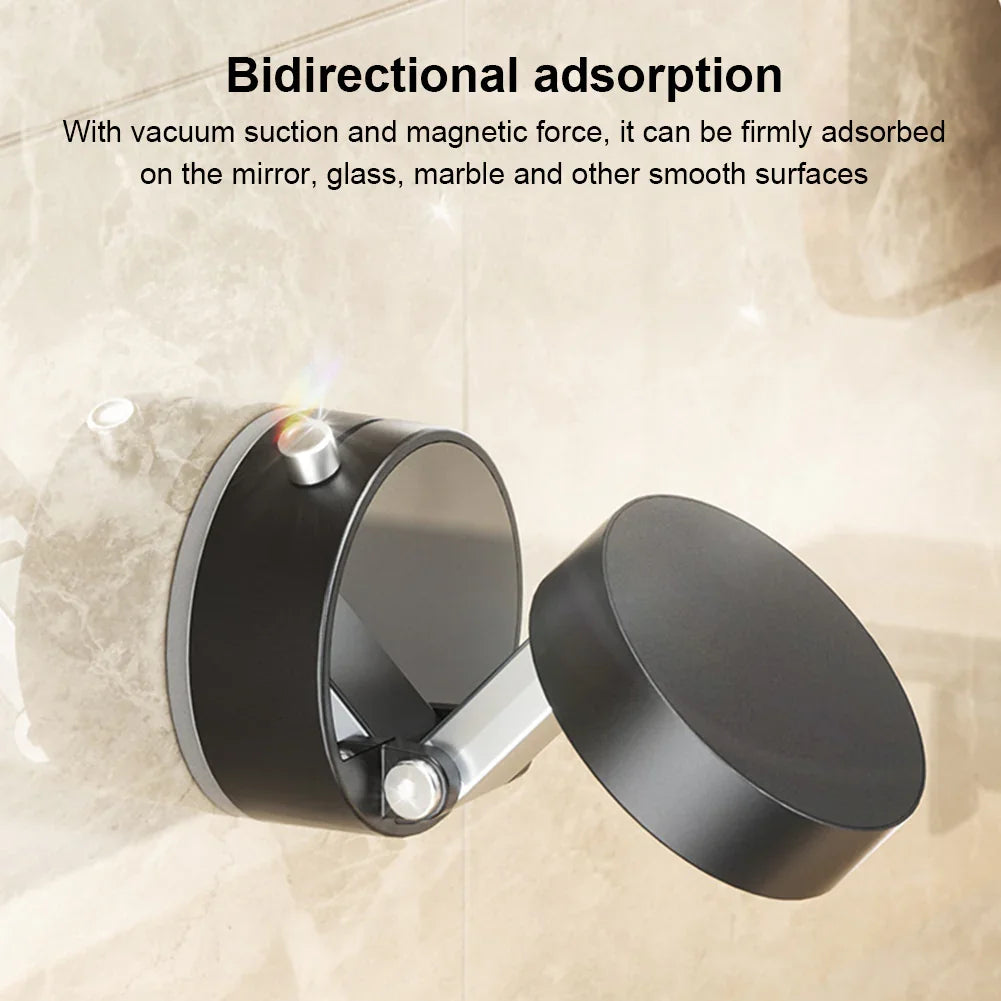 Black suction and magnetic mount attached to beige marble wall with bidirectional adsorption feature