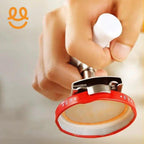 Hand holding a stainless steel portafilter with red silicone gasket for espresso machine