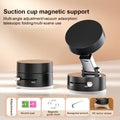 Black suction cup magnetic support with multi-angle adjustment and attachments on beige surface